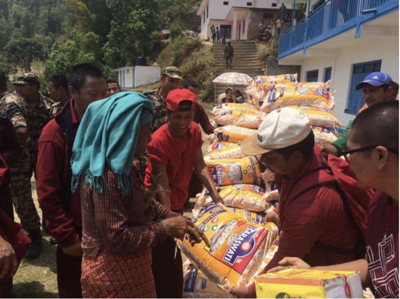 Relief supplies of rice being distributed to villagers in Nepal