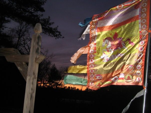 A prayer flag bearing the wind horse, fluttering in the wind